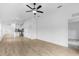 Spacious open-concept living space with recessed lighting, wood-look floors, and bright kitchen view at 4743 Michaler St, North Port, FL 34286