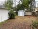 View of the backyard with a shed and privacy fence at 6919 Greenhill Pl, Tampa, FL 33617