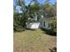 A fenced backyard that offers a private and secluded space at 6919 Greenhill Pl, Tampa, FL 33617