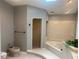 Bathroom with walk-in shower and whirlpool bathtub at 6919 Greenhill Pl, Tampa, FL 33617