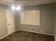 Bedroom with carpet, ceiling fan, and shuttered window at 6919 Greenhill Pl, Tampa, FL 33617