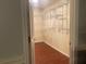 Walk-in closet with built-in shelving and wood-look flooring at 6919 Greenhill Pl, Tampa, FL 33617