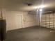 Attached garage with door to house and garage door at 6919 Greenhill Pl, Tampa, FL 33617
