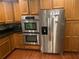 The kitchen features stainless steel appliances including double ovens and a side-by-side refrigerator at 6919 Greenhill Pl, Tampa, FL 33617
