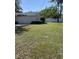 Lush backyard featuring a well-maintained lawn and a white fence, perfect for outdoor enjoyment at 6919 Greenhill Pl, Tampa, FL 33617