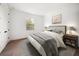 Comfortable bedroom with a cozy bed, nightstands, and carpeted floor creating a relaxing retreat at 1046 Bass Blvd, Dunedin, FL 34698