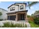 Beautiful two-story home with lush, manicured landscaping at 1046 Bass Blvd, Dunedin, FL 34698