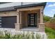 Inviting brick porch with brick columns and modern front door at 1046 Bass Blvd, Dunedin, FL 34698