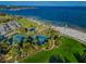 Spectacular aerial view featuring tennis courts next to the park, beach, and bay, offering diverse leisure activities at 216 21St Ne Ave, St Petersburg, FL 33704
