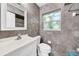 Updated bathroom with a modern vanity, tiled walls, and neutral color scheme for a clean, fresh feel at 216 21St Ne Ave, St Petersburg, FL 33704