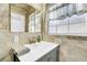 Bathroom features granite countertops, a vanity, and a large mirror at 216 21St Ne Ave, St Petersburg, FL 33704