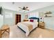 A charming bedroom features a ceiling fan, stylish decor, and bright, natural light for a cozy and inviting atmosphere at 216 21St Ne Ave, St Petersburg, FL 33704