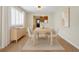 Dining room with light wood furniture, neutral decor, and view to kitchen at 216 21St Ne Ave, St Petersburg, FL 33704