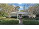 Charming single-story home with well-maintained landscaping, brick walkway, and inviting entrance at 216 21St Ne Ave, St Petersburg, FL 33704