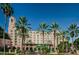 Elegant hotel exterior with lush palm trees, manicured landscape, and clear blue sky at 216 21St Ne Ave, St Petersburg, FL 33704