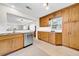 Spacious kitchen with wood cabinets, stainless steel appliances, and granite countertops at 216 21St Ne Ave, St Petersburg, FL 33704