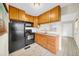 Efficient kitchen featuring stainless steel appliances, granite countertops, and ample cabinet space at 216 21St Ne Ave, St Petersburg, FL 33704