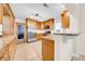Spacious kitchen featuring stainless steel appliances, wood cabinets, granite counters and convenient breakfast bar at 216 21St Ne Ave, St Petersburg, FL 33704