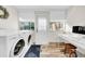 Laundry room with workstation, exterior door and plenty of natural light at 216 21St Ne Ave, St Petersburg, FL 33704
