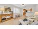 Comfortable seating area with a view to the kitchen and shuttered windows at 216 21St Ne Ave, St Petersburg, FL 33704