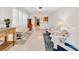 Open living space with view to kitchen and white chairs at 216 21St Ne Ave, St Petersburg, FL 33704