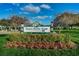 Entrance sign for North Shore Park in St. Petersburg, surrounded by colorful flowers and lush greenery at 216 21St Ne Ave, St Petersburg, FL 33704
