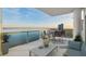 Balcony with a table and chairs with bay views at 2910 W Barcelona St # Ph-2303, Tampa, FL 33629