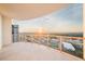 Spacious balcony with glass railings, offering stunning city and sunset views at 2910 W Barcelona St # Ph-2303, Tampa, FL 33629