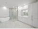 A spacious bathroom with a glass shower, a free-standing tub, and and vanity at 2910 W Barcelona St # Ph-2303, Tampa, FL 33629