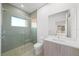 A modern bathroom with a glass shower, a modern sink, and hardwood floors at 2910 W Barcelona St # Ph-2303, Tampa, FL 33629