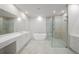 A spacious bathroom with a glass shower, a free-standing tub, and a and vanity at 2910 W Barcelona St # Ph-2303, Tampa, FL 33629