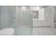 Bright bathroom featuring a glass shower, and vanity, and marble floors at 2910 W Barcelona St # Ph-2303, Tampa, FL 33629