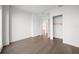 Bright bedroom featuring hard floors, light walls, closet, and door frame to another room at 2910 W Barcelona St # Ph-2303, Tampa, FL 33629