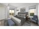 A well-staged bedroom with a king-sized bed and a view at 2910 W Barcelona St # Ph-2303, Tampa, FL 33629