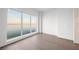 Bright bedroom featuring large windows with stunning water views and hardwood flooring at 2910 W Barcelona St # Ph-2303, Tampa, FL 33629