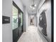 Elegant hallway features marble flooring, modern lighting, and access to the fitness center at 2910 W Barcelona St # Ph-2303, Tampa, FL 33629