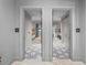 Elegant hallway featuring designer tile flooring, leading to guest suites with modern decor at 2910 W Barcelona St # Ph-2303, Tampa, FL 33629