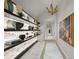 Artistic hallway design with marble floors, decorative shelving, and stylish lighting fixtures at 2910 W Barcelona St # Ph-2303, Tampa, FL 33629