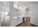 Open-concept space including a mini bar and living room, modern finishes, and abundant natural light at 2910 W Barcelona St # Ph-2303, Tampa, FL 33629