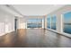 Open living area with hardwood floors, expansive windows, and panoramic views of the waterfront at 2910 W Barcelona St # Ph-2303, Tampa, FL 33629