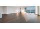 Bright living room with wood floors and floor to ceiling windows with bay views at 2910 W Barcelona St # Ph-2303, Tampa, FL 33629