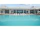 Beautiful resort-style pool deck features lounge chairs, clear blue water, and access to the amenity center at 2910 W Barcelona St # Ph-2303, Tampa, FL 33629