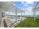 Relaxing rooftop pool area with modern pergola and stunning skyline views at 2910 W Barcelona St # Ph-2303, Tampa, FL 33629