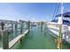 This waterfront home features a private boat dock with easy access to the open water, perfect for boating enthusiasts at 340 Pinellas Bayway S # 306, Tierra Verde, FL 33715