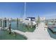 Dock with sailboat offers easy access to the waterfront and marina amenities at 340 Pinellas Bayway S # 306, Tierra Verde, FL 33715
