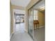 Hallway leads to bonus room and sunroom with views of the pool and marina at 340 Pinellas Bayway S # 306, Tierra Verde, FL 33715