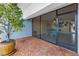 Screened-in patio area leads to an outdoor brick patio with waterfront views at 340 Pinellas Bayway S # 306, Tierra Verde, FL 33715
