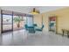 Comfortable sunroom overlooking the pool and waterfront is perfect for relaxation at 340 Pinellas Bayway S # 306, Tierra Verde, FL 33715