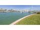 Picturesque waterfront view featuring boats, docks, and lush green landscape at 340 Pinellas Bayway S # 306, Tierra Verde, FL 33715