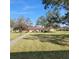The backyard has a lush lawn with trees offering a peaceful outdoor setting at 4920 Locust Ne St # 203, St Petersburg, FL 33703